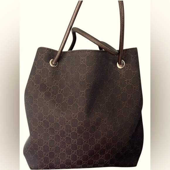 Gucci canvas tote in good condition; minor signs of wear at base corner. - Picture 1 of 4